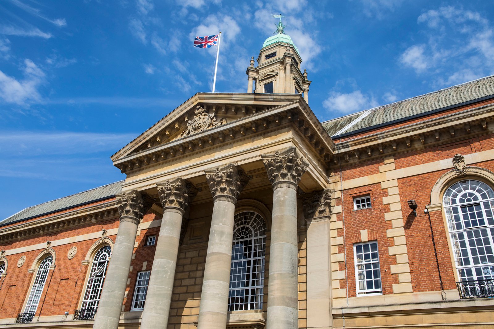 Looking up at the magnificent facade of Peterborough Town Hall, home of the Peterborough City Council, in Peterborough, UK.